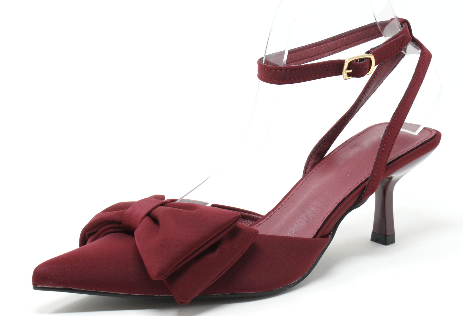 Maroon high-heeled shoe with bow detail on a white background
