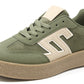 Green sneaker with beige accents on a white background