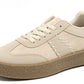 Beige sneaker with a brown sole on a white background