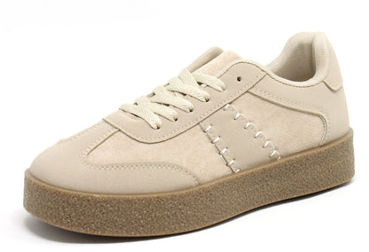 Beige sneaker with a brown sole on a white background