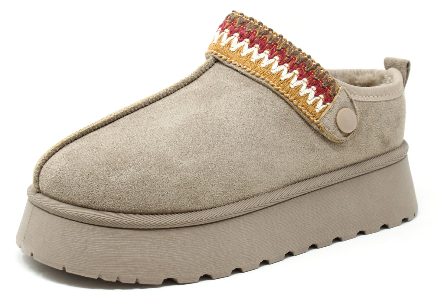 Beige slip-on shoe with a colorful woven strap on a white background