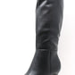 Black knee-high boot with a high heel on a white background