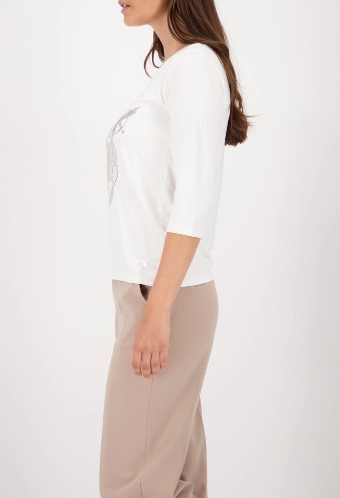 Top with decorative emblem