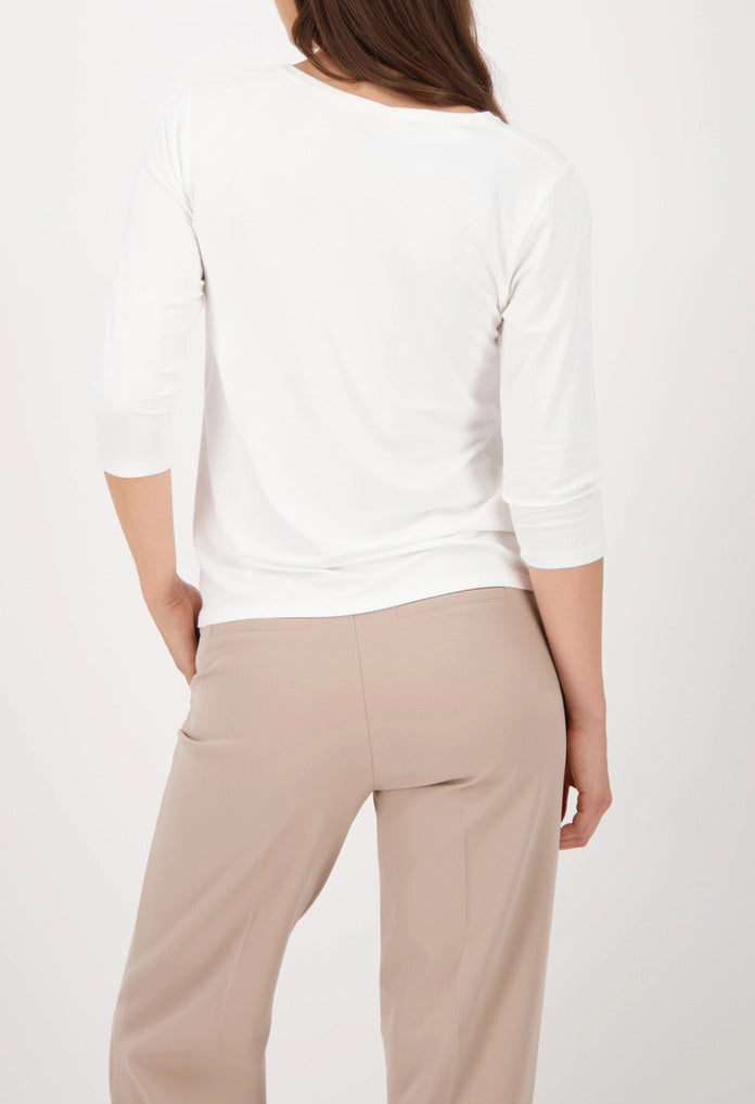 Top with decorative emblem