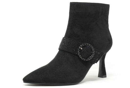 Black ankle boot with a decorative strap on a white background