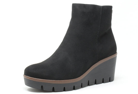 Black wedge ankle boot on a white background