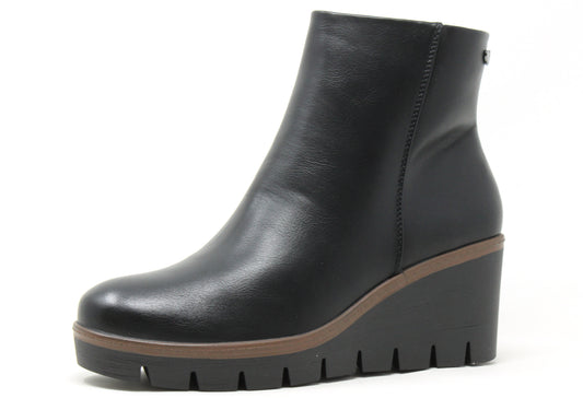 Black wedge ankle boot on a white background