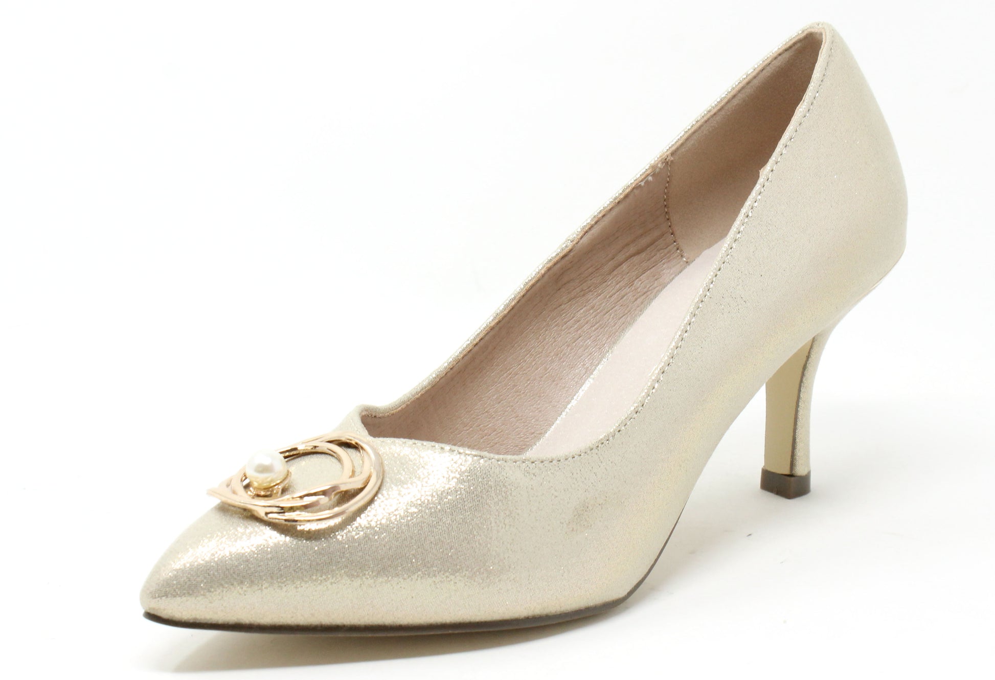Gold high-heeled shoe with a decorative emblem on a white background