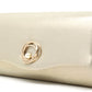 Gold clutch bag with a decorative ring on a white background