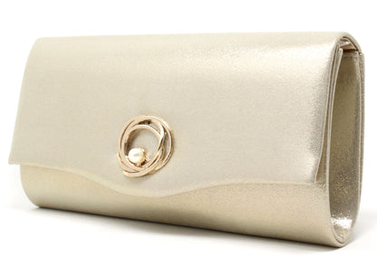 Gold clutch bag with a decorative ring on a white background