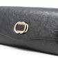 Black clutch bag with a gold clasp on a white background