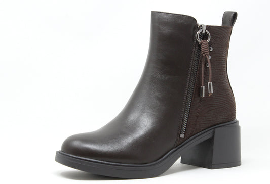 Black leather ankle boot with a zipper on a white background