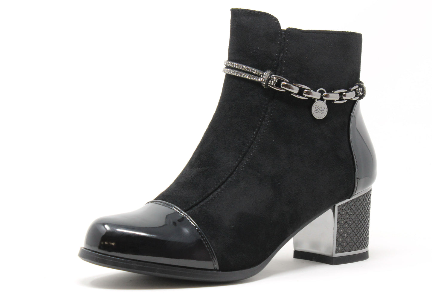 Black ankle boot with chain detail on a white background