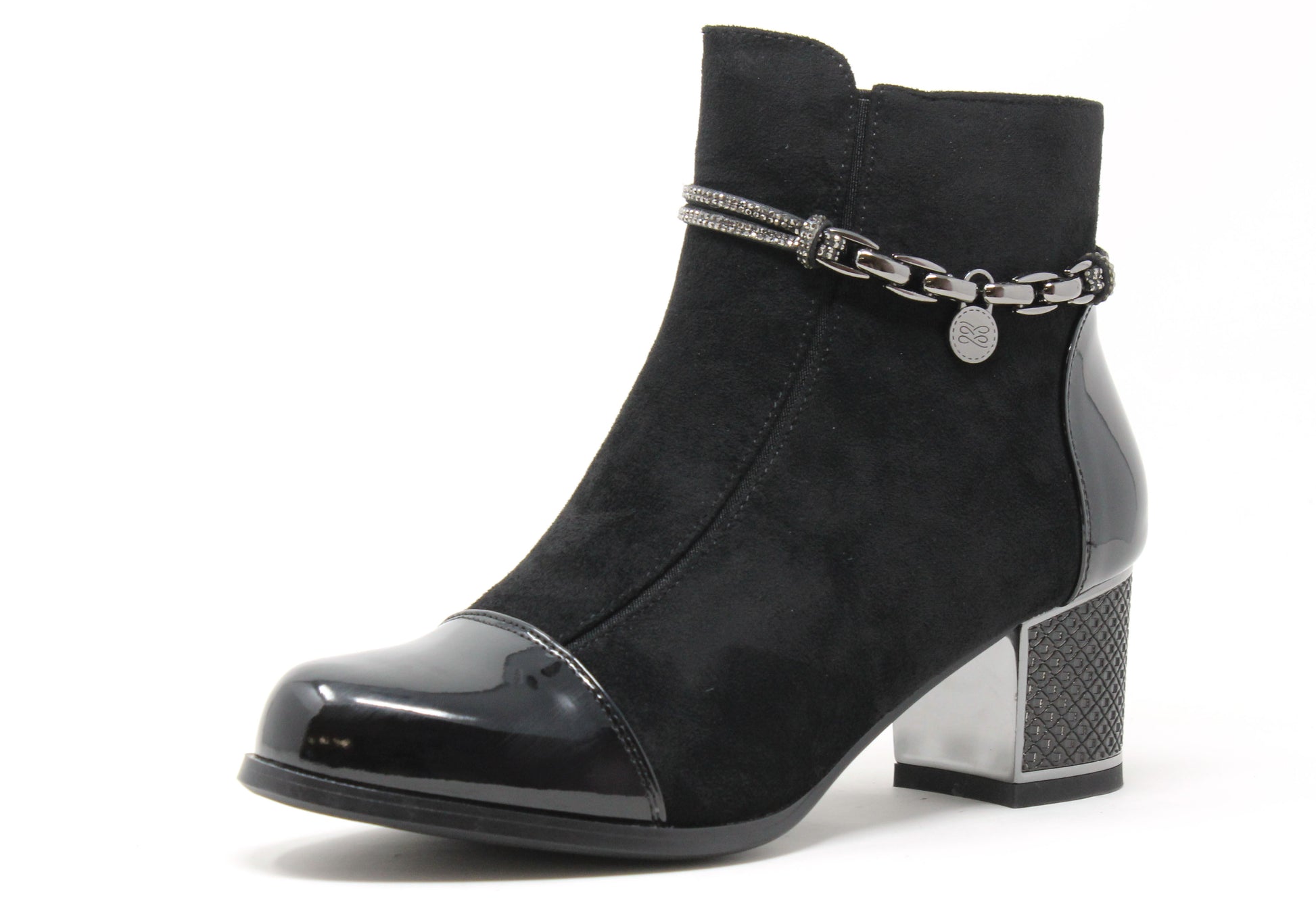 Black ankle boot with chain detail on a white background