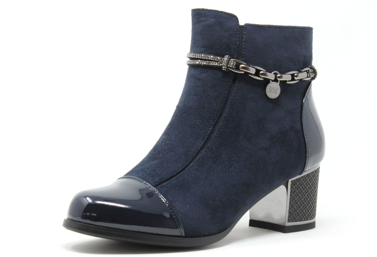 Navy blue ankle boot with a metallic chain detail on a white background