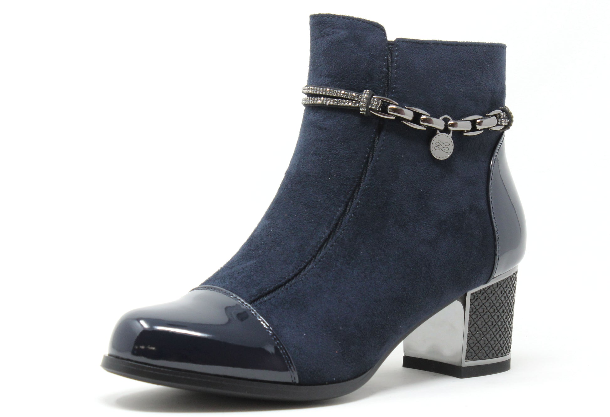 Navy blue ankle boot with a metallic chain detail on a white background