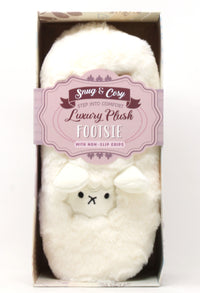 White plush footie with a label in a box