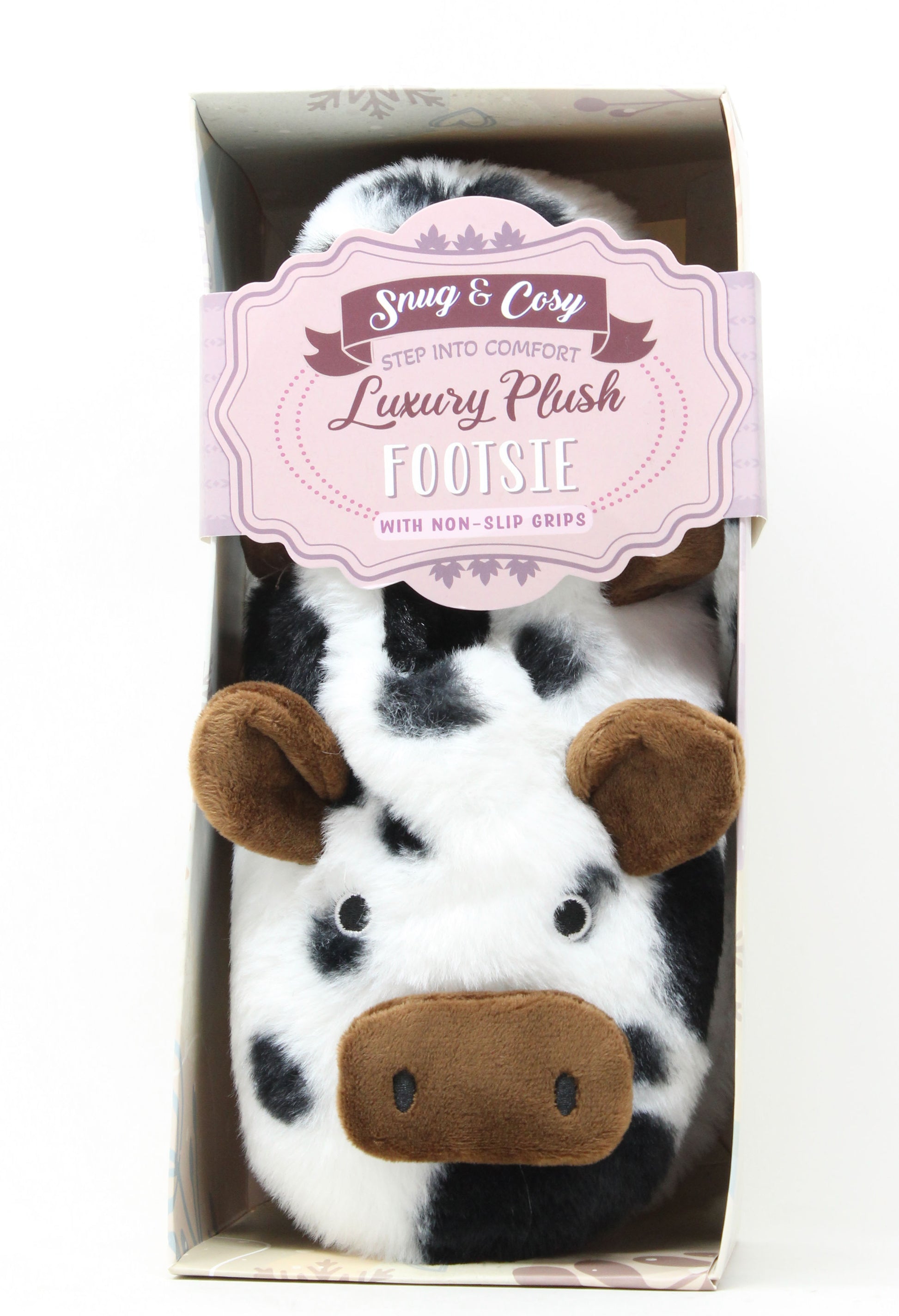 Cow-themed plush feeties in packaging with a visible brand label.