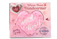 Pink heart-shaped handwarmer with 'Warm Heart' text on a matching packaging box.