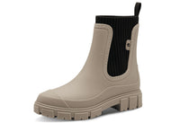 Beige rubber boot with a black inner lining on a white background