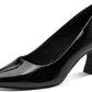 Black patent leather high heel shoe on a white background