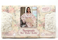 Therapeutic hot water bottle packaging with a woman in pajamas on a floral background