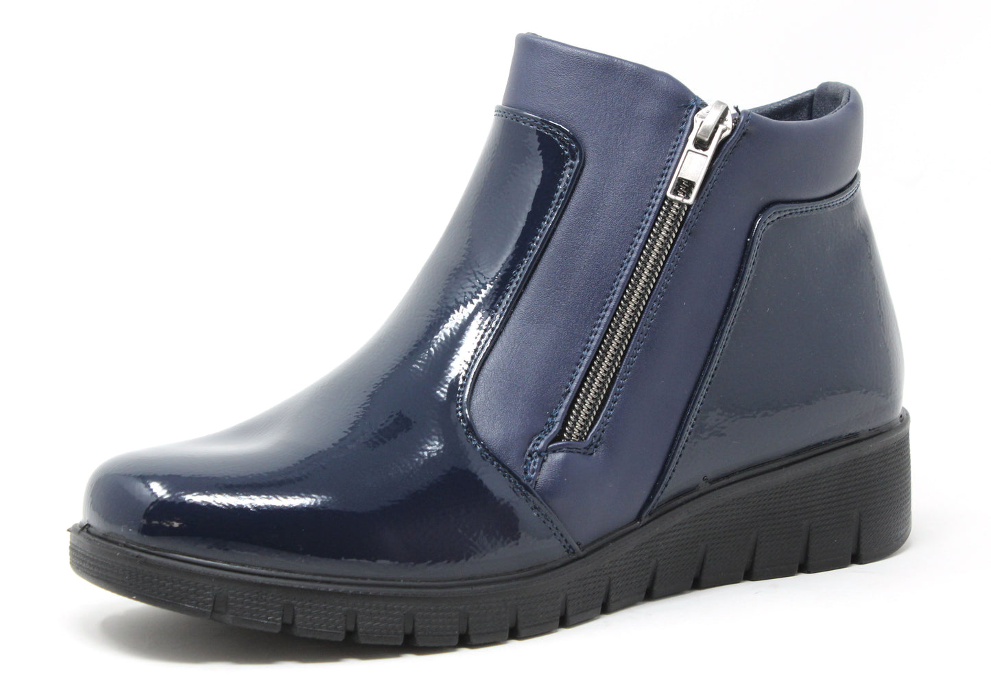 navy patent leather ankle boot with a zipper on a white background