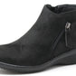 black faux suede boot with zip detail on a white background