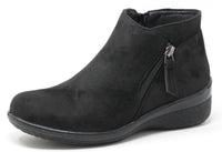 black faux suede boot with zip detail on a white background