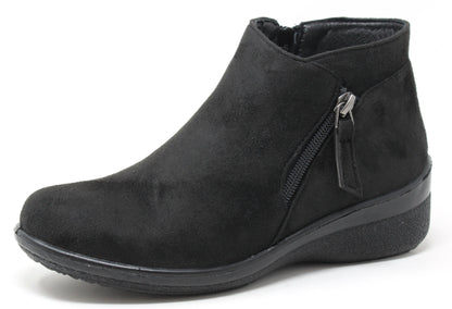black faux suede boot with zip detail on a white background