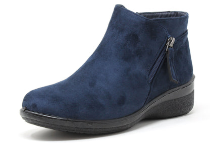 navy faux suede boot with zip detail on a white background