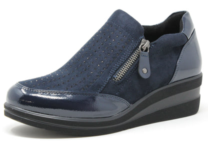 Blue slip-on shoe with a zipper on a white background