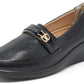 Black loafer shoe with a gold buckle on a white background
