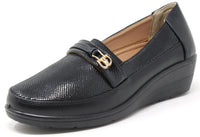 Black loafer shoe with a gold buckle on a white background