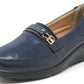Navy blue loafer shoe with a gold buckle on a white background