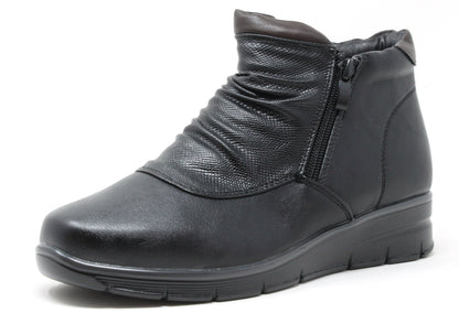 Black ankle boot on a white background