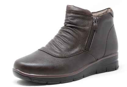 Brown leather ankle boot on a white background