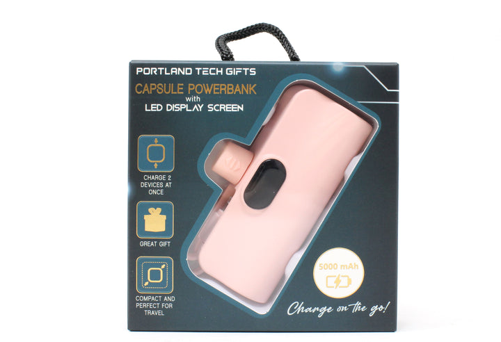Pink power bank in packaging with text on a white background