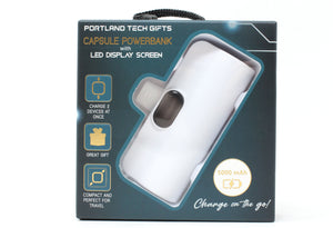 Packaging of a Portland Tech Gifts capsule powerbank with LED display screen on a white background.