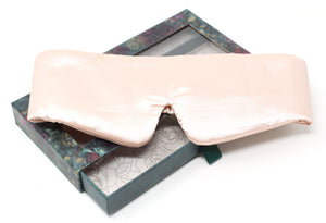 Silk eye mask in a decorative box on a white background
