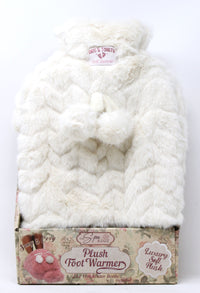 Plush foot warmer in packaging with visible brand label on a white background