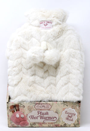 Plush foot warmer in packaging with visible brand label on a white background