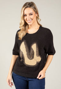 woman wearing soft knit top with diamante detail