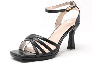 Black strappy sandal on a white background