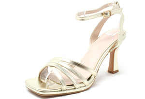 Gold high-heeled sandal on a white background