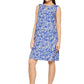 Woman wearing a blue floral dress on a white background