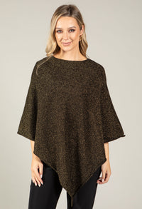 Woman wearing a brown poncho against a plain background