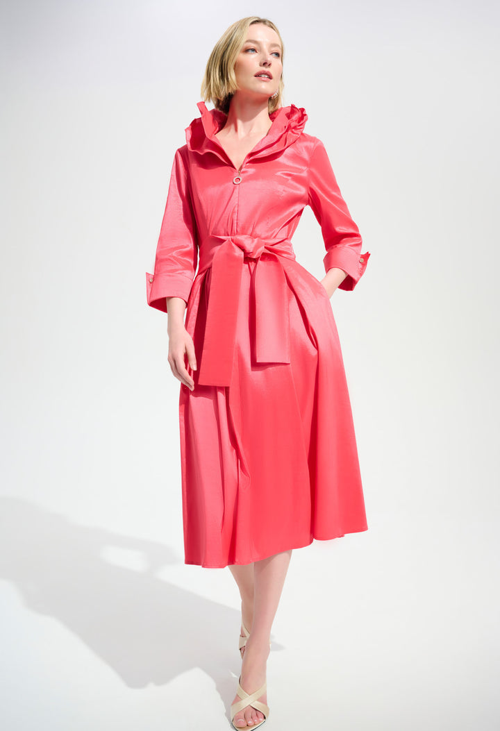 Woman wearing a wrap style dress on a white background