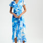 Woman wearing a blue floral dress on a white background