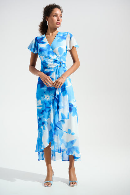 Woman wearing a blue floral dress on a white background